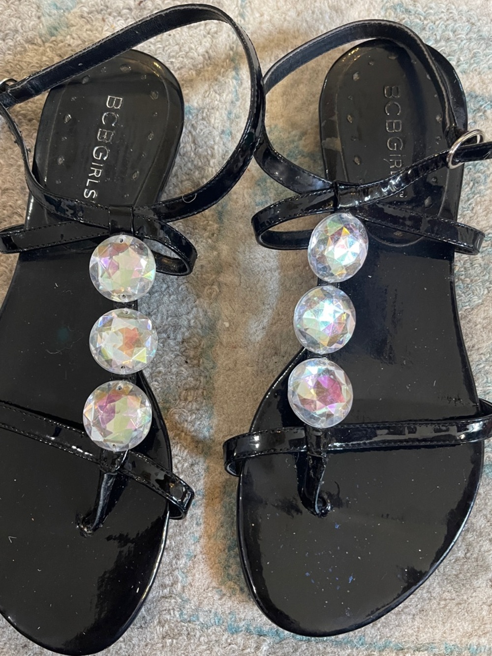BCBGirls Black Patent T-Strap Sandals with Iridescent Gem Detailing